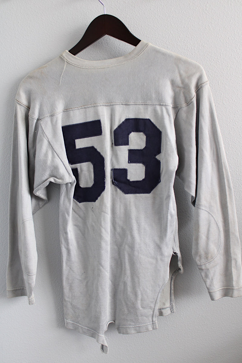 Women's or men's vintage 1960's Southern Manufacturing Co., Quality Athletic Wear, Made in USA label long sleeve sport jersey in light grey with navy letters.