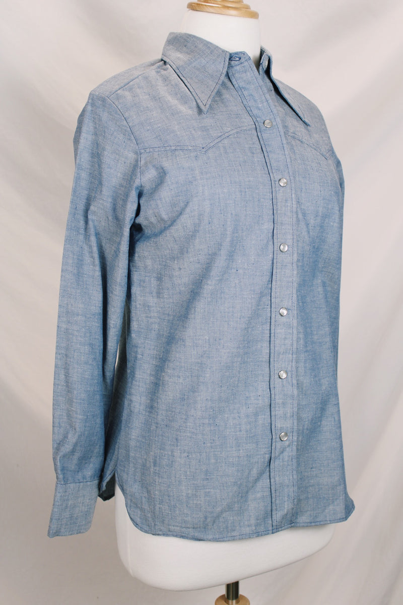 Women's vintage 1970's Maverick, Made in USA label long sleeve light blue chambray button up blouse with a western style.