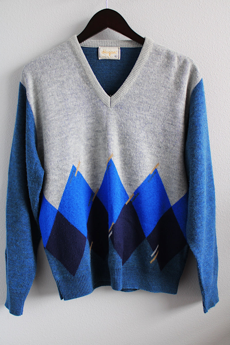 Women's or men's vintage 1980's Hogan label long sleeve blue argyle printed pullover sweater with a V shaped neckline in a soft acrylic material.