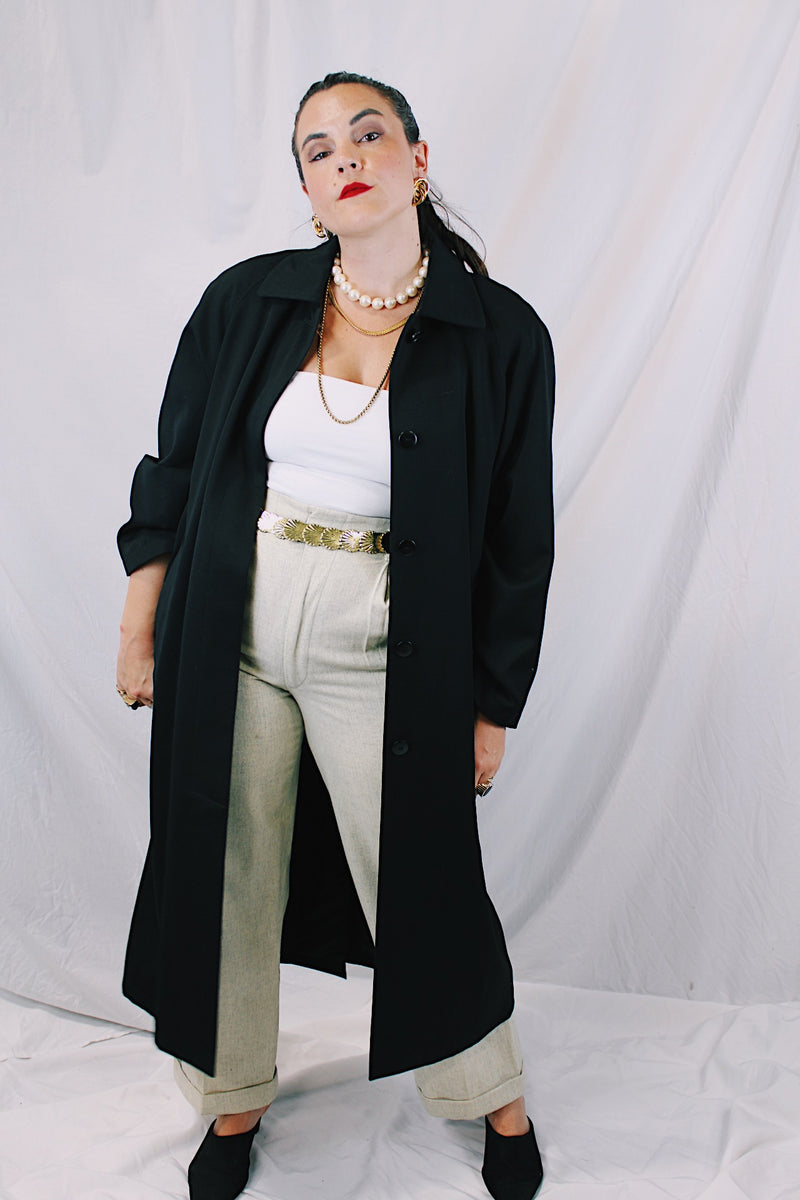 Women's vintage 1990's Nordstrom - Point of View label long sleeve long length black trench coat in a wool material. Fully lined, side pockets, back slit, and shoulder pads. 