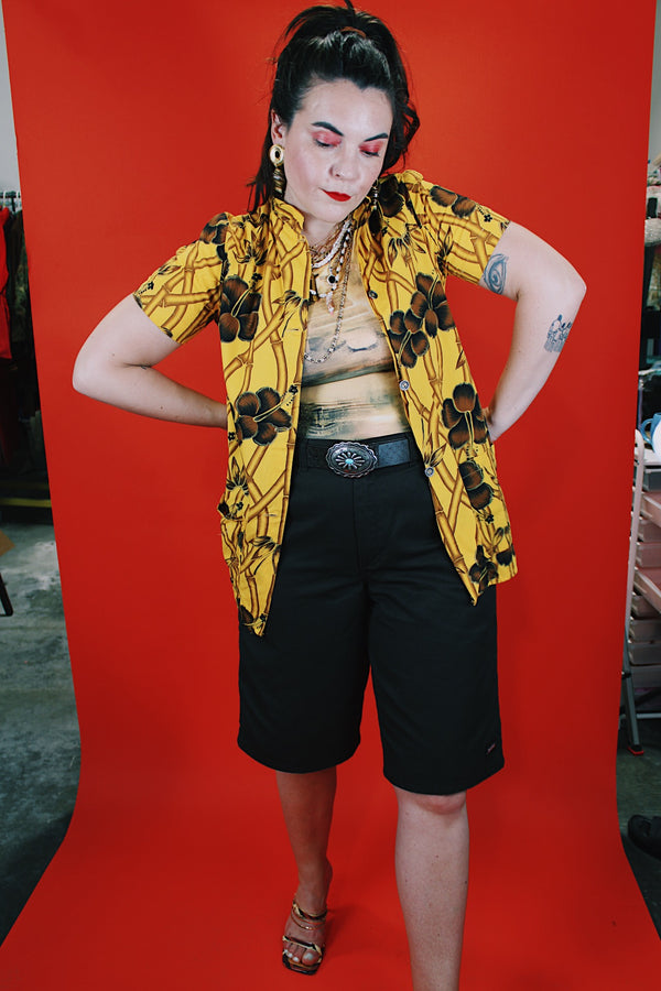 Women's vintage 1970's La Rosa, San Francisco label short sleeve button up blouse in yellow with all over brown Hawaiian print.