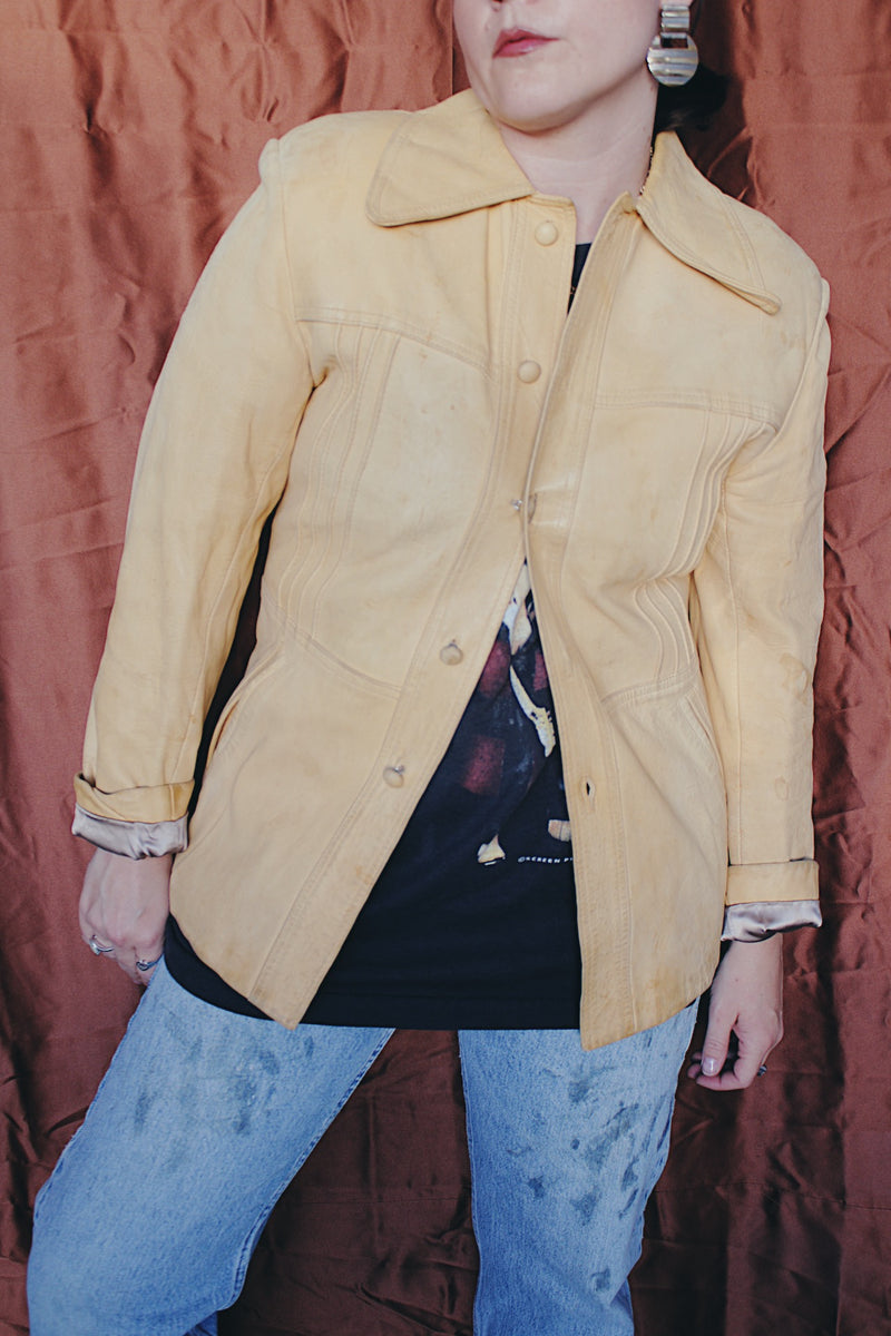 Women's or men's vintage 1970's Styled by Scully in Los Angeles long sleeve long length tan camel colored leather jacket with leather buttons up the front.