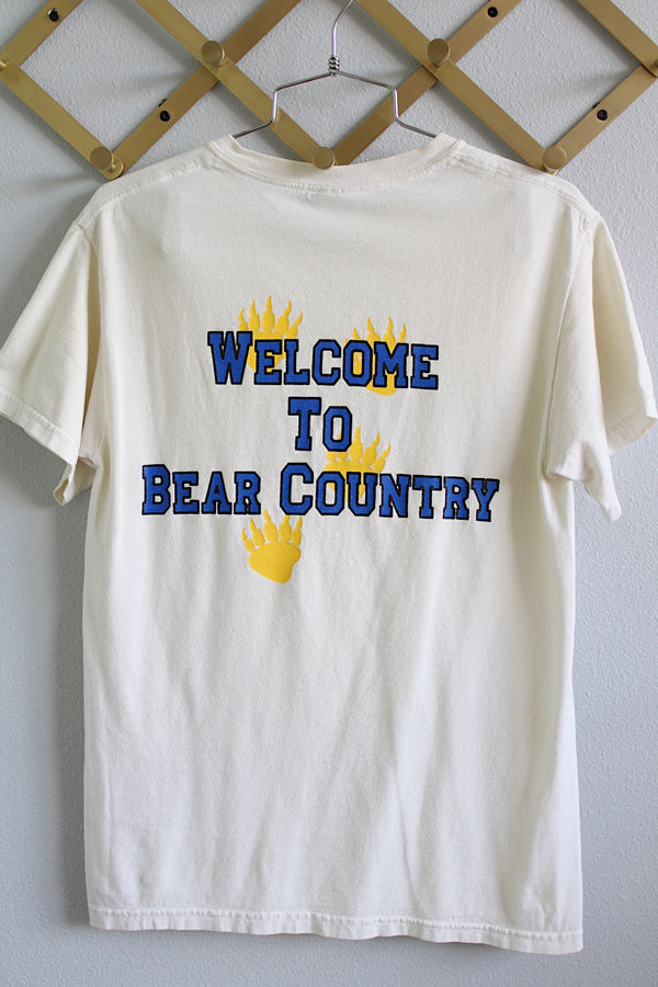 Women's or men's vintage 1990's Gildan Ultra Cotton label short sleeve white tee with text on the front and the back in blue and yellow. A Mt. Shasta High School tee in cotton material.