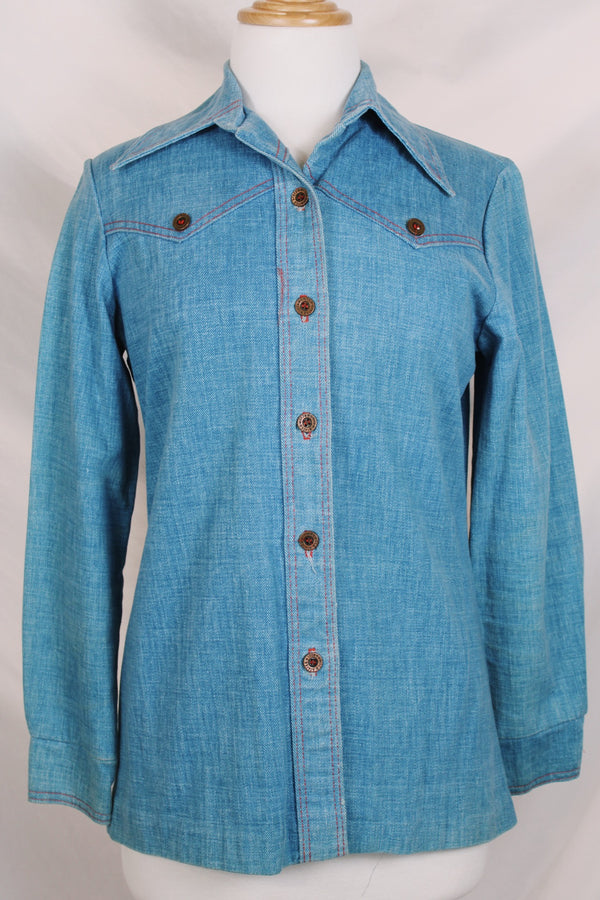 Women's vintage 1970's long sleeve medium wash denim chambray button up blouse with red contrast stitching and brass buttons. 