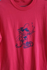 Women's or men's vintage 1980's short sleeve red cotton graphic t-shirt. Cheetos mascot graphic on the front, text on the back.