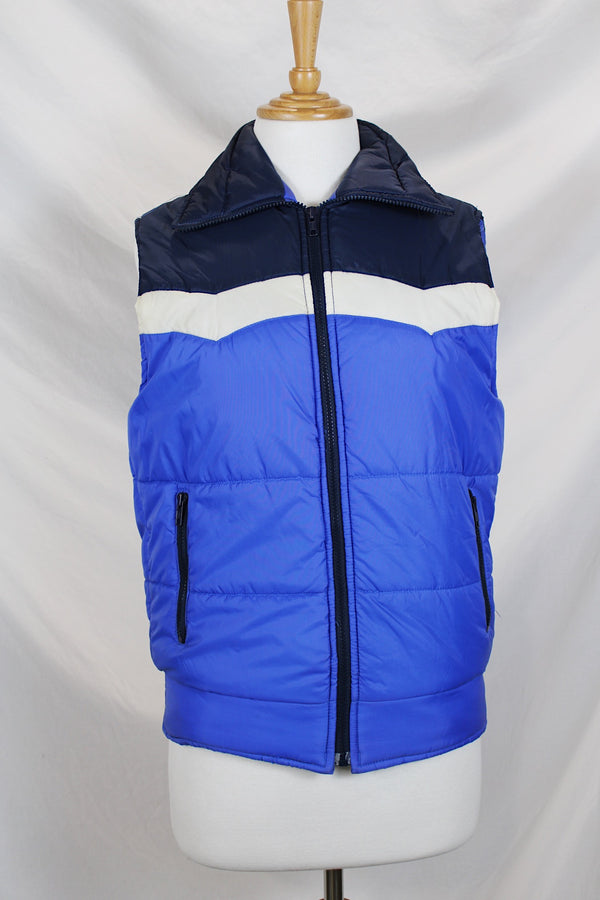 Women's or men's vintage 1970's Sears, Boys label sleeveless puffy vest in white, navy, and blue. Side pockets and zipper up the front. 