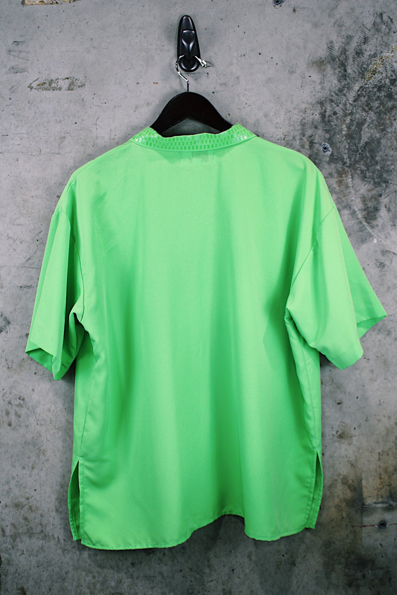 Women's vintage 1980's Collection by Shirq, New York, Made in USA label short sleeve bright lime green button up blouse with collar and shiny trim in a lightweight poly material.