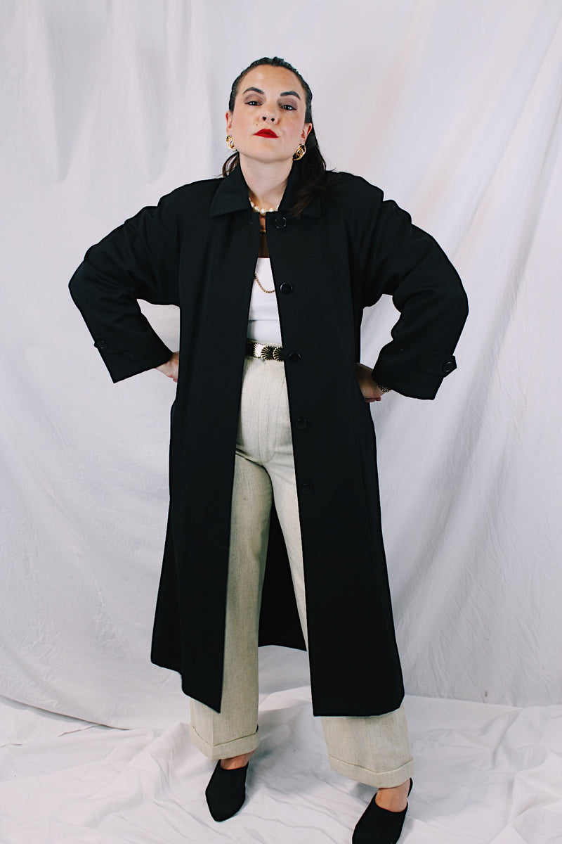 Women's vintage 1990's Nordstrom - Point of View label long sleeve long length black trench coat in a wool material. Fully lined, side pockets, back slit, and shoulder pads. 