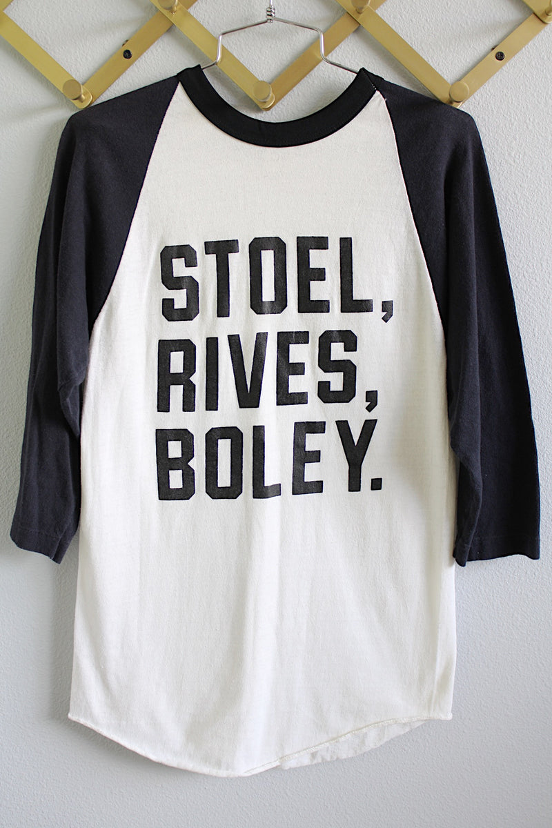Women's or men's vintage 1970's Russell Athletic long sleeve black and white baseball tee with text on the back.