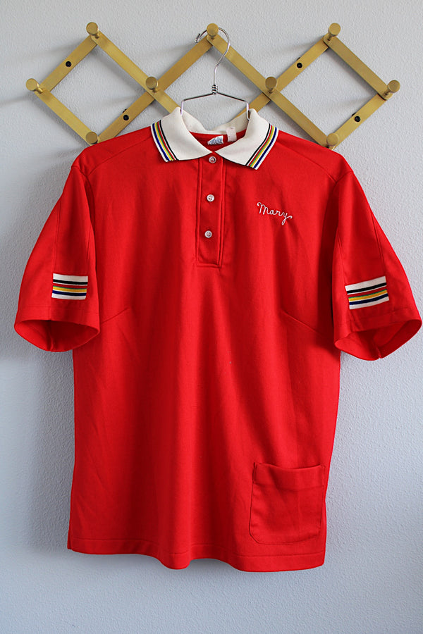 Women's vintage 1970's Hilton, Made in USA label short sleeve red half button closure polo bowling shirt with white striped collar and trim. 