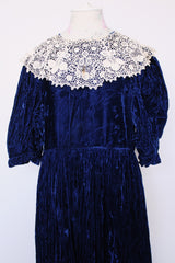 Women's vintage 1970's crushed blue velvet dress with cream embroidery peter pan collar. Short sleeves and ankle length.