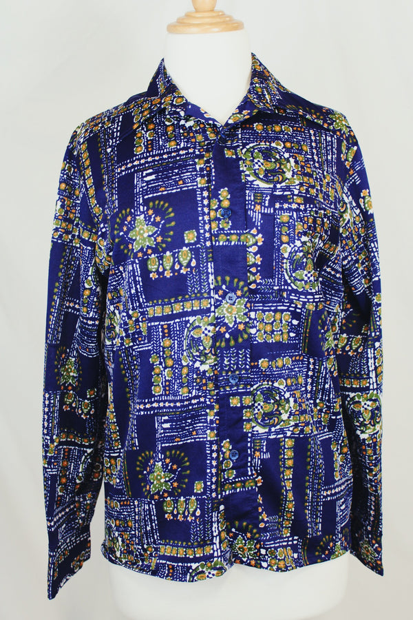 Men's or women's vintage 1970's Jantzen 100, Made in USA label long sleeve button up shirt in vibrant navy blue with all over orange, green, and white floral print.