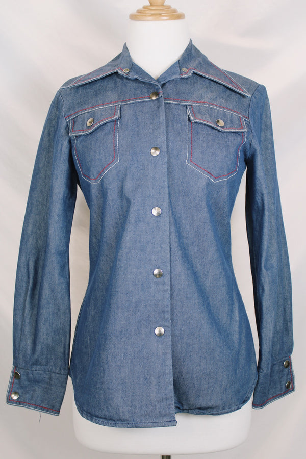 Women's vintage 1970's By Bogat of Texas long sleeve button up medium wash denim chambray top with red and white contrast stitching. 