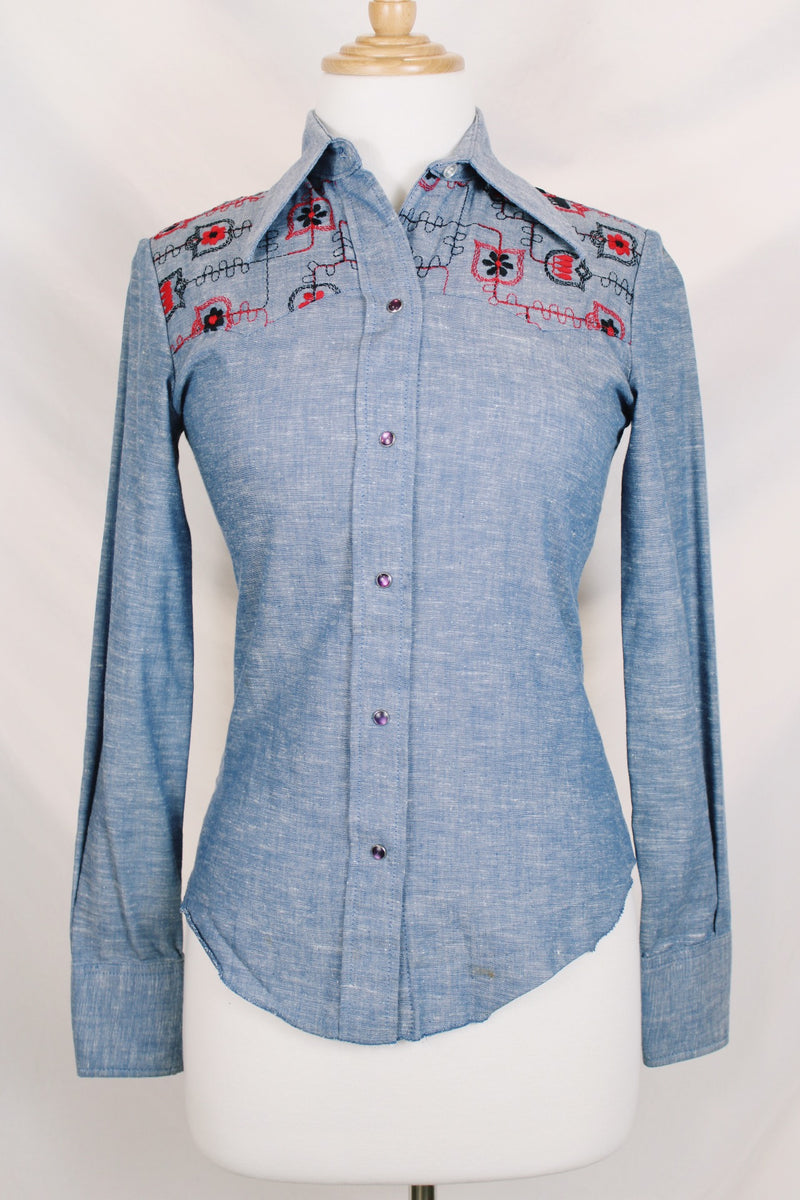 Women's vintage 1970's Western Trends by Panhandle Slim, Made in USA label long sleeve chambray denim top with black and white embroidery. 