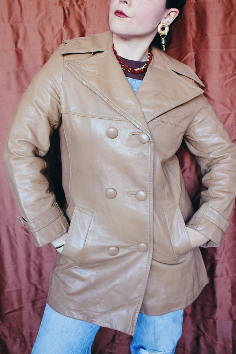Women's vintage 1970's Nordstrom label long length long sleeve tan brown colored double breasted leather trench coat.