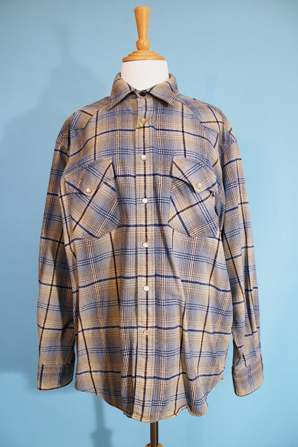 Men's vintage 1970's Pendleton label long sleeve button up western style shirt in a wool material and blue colors. Pearl silver snapper buttons.