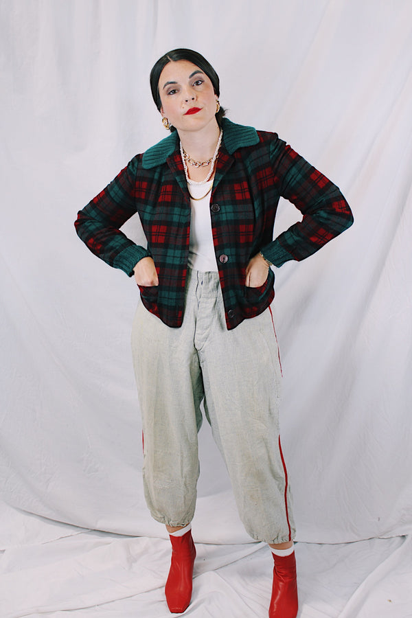 Women's vintage 1960's Pendleton label long sleeve plaid print wool cropped lightweight jacket in red and green colors. Fully lined, buttons up the front, and two front pockets.