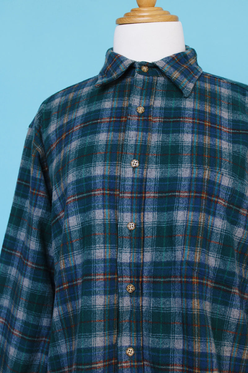Men's vintage 1980's Pendleton, Made in USA label long sleeve plaid print button up shirt with tan elbow pads. Green and blue colors in a wool material.