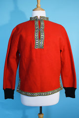 Women's vintage 1960's Product of Norway, Manufactured by Petersen & Dekke label Norwegian style pullover sweater in red wool with decorative trim and metal clasp closures