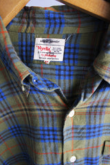 Men's vintage 1960's Viyella by Hathaway, Ancient Kennedy, Woven in Great Britain long sleeve button up shirt with clear buttons and one left chest pocket. Olive green with blue, red, and black plaid print.