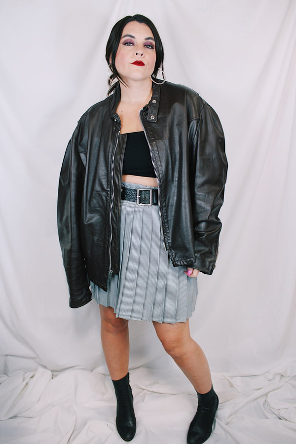 Men's or women's vintage 1980's Kirk's Suede Life label long sleeve oversized dark chocolate brown leather bomber jacket with zipper front closure. 