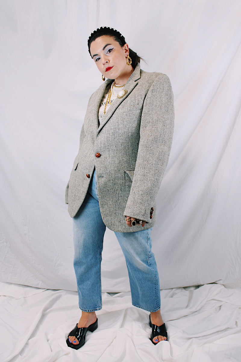 Men's or women's vintage 1960's Nordstrom, Harris Tweed, Tailored in the USA label long sleeve grey colored wool blazer with front pockets and partial lining.