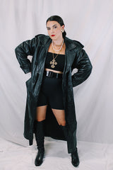 Men's or women's vintage 1980's Vakko Sport, Made in USA label long sleeve long length black leather trench coat. Double breasted closure, shoulder pads, and matching tie belt.