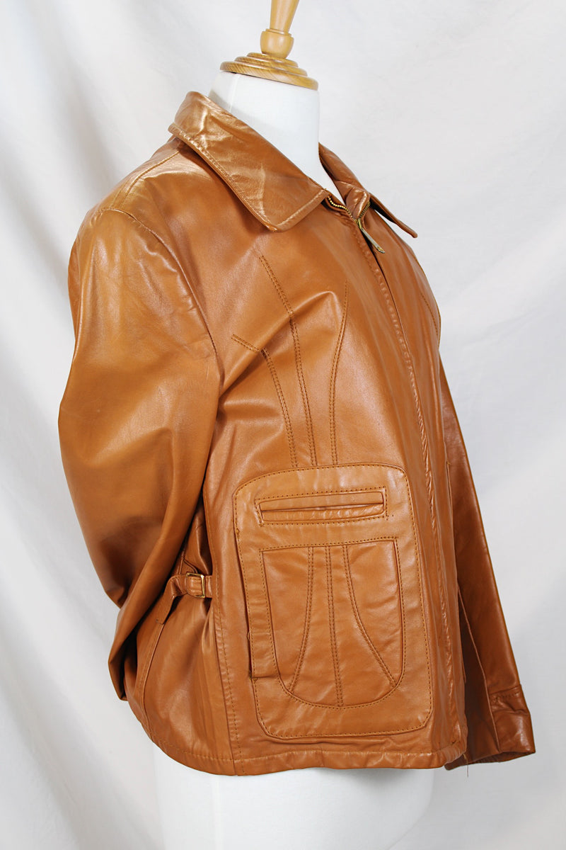 Men's or women's vintage 1970's The Leather Shop, Sears The Men's Store label long sleeve short length camel brown colored leather zip up jacket.