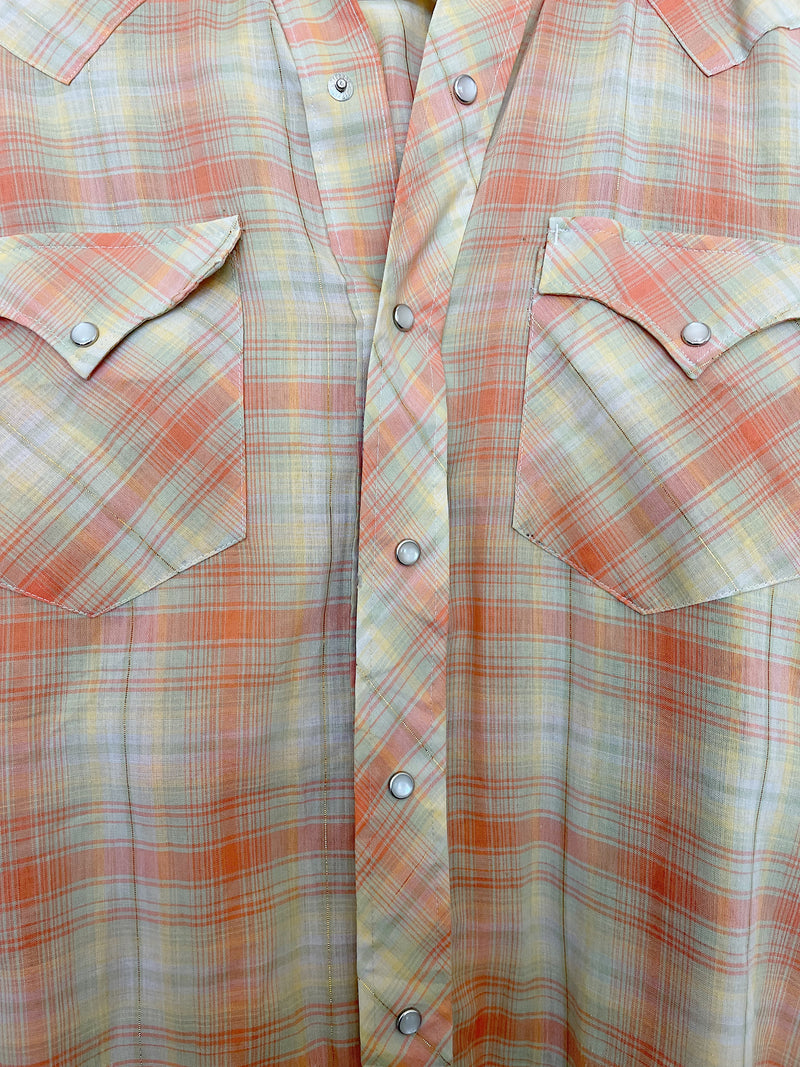 Men's or women's vintage 1970's long sleeve plaid print Western style shirt with pearl white snapper buttons and silver hardware. Light green, coral, yellow, and gold metallic colors. 