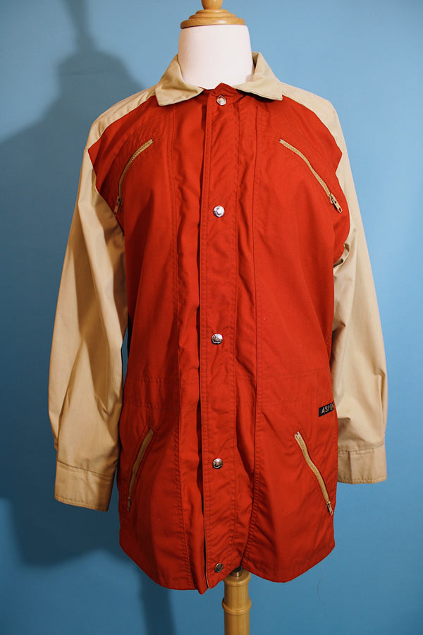 Women's or men's vintage 1980's Aspen label long sleeve zip up lightweight windbreaker jacket in tan and burn orange. 
