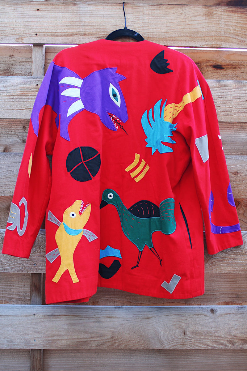 Women's vintage 1980's Mr. Girasol, Made in Mexico label long sleeve open front lightweight jacket in red with all over multicolored animals. 