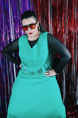 Women's vintage 1970's Saks Alley label sleeveless midi length kelly green polyester dress with sequin detail on chest. 