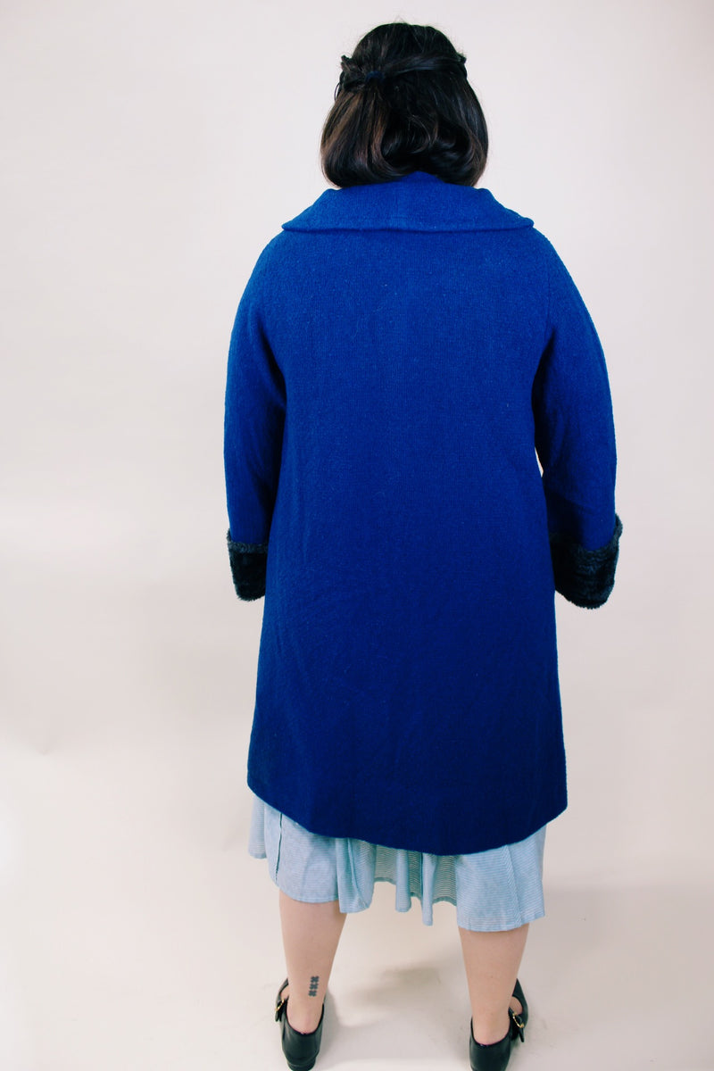 Women's vintage 1960's Jack Bloom California label long sleeve royal blue color coat. Ankle length with grey fur trim around collar and cuffs.