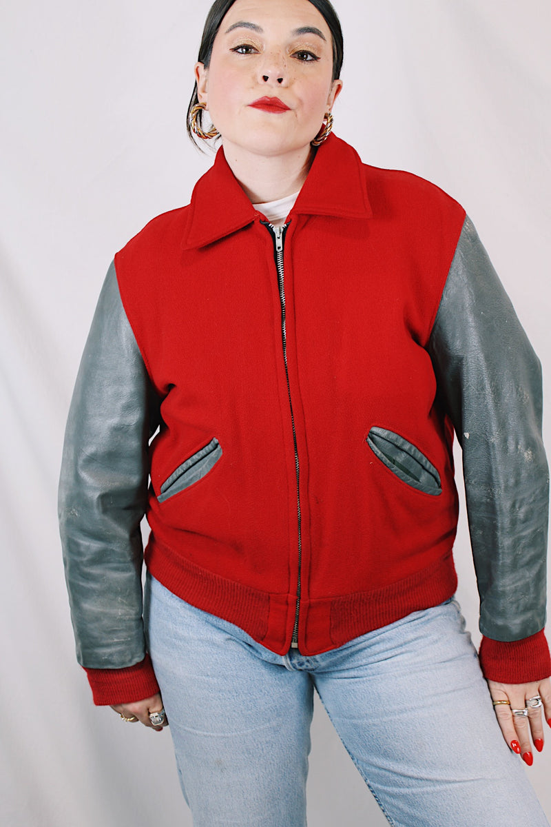Men's or women's vintage 1960's Dick Longtin's Sports Huddle label long sleeve leather and wool zip up varsity letterman jacket in grey and red with pockets and nylon liner.