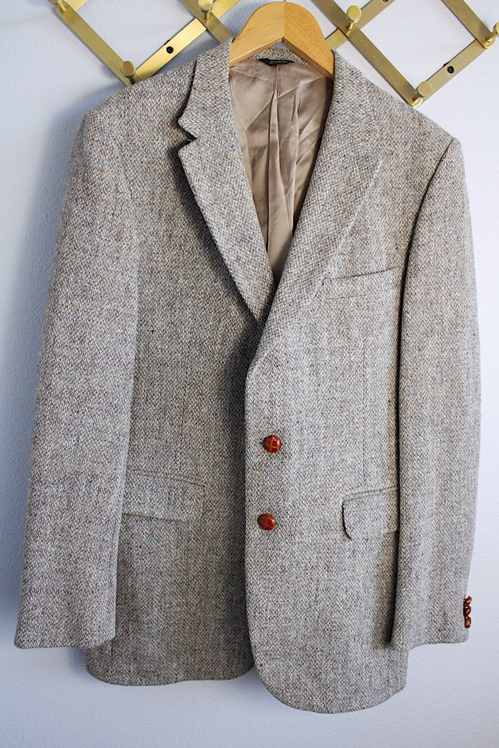 Men's or women's vintage 1960's Nordstrom, Harris Tweed, Tailored in the USA label long sleeve grey colored wool blazer with front pockets and partial lining.