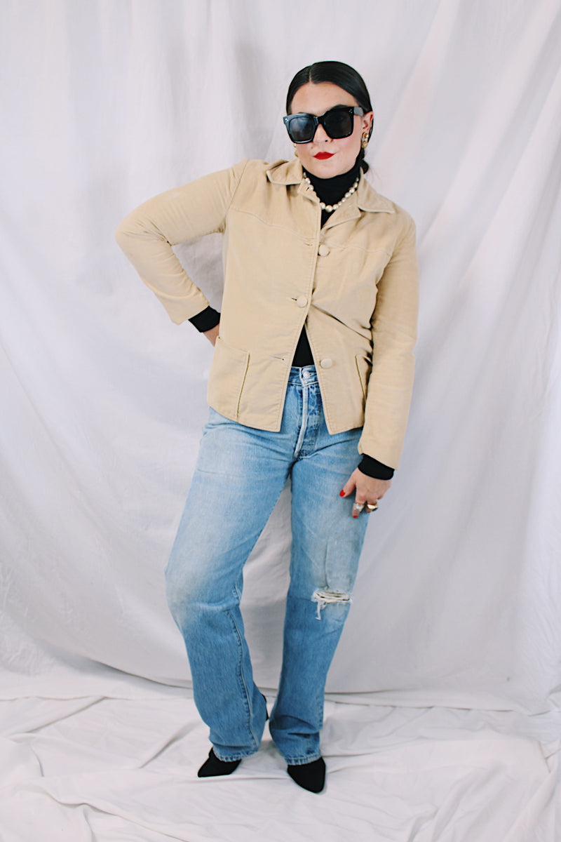 Women's vintage 1960's Union Made, Genuine Heeksuede Made in Holland label long sleeve short length tan colored suede button up lightweight jacket. Two front pockets and pink liner.