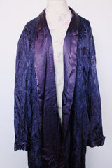 Women's vintage 1960's long sleeve purple satin robe. Long length and shiny material. Chest pocket and two side pockets.