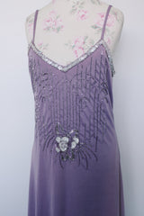 Women's vintage 1980's sleeveless ankle length purple dress with spaghetti straps and bead and sequins across chest.
