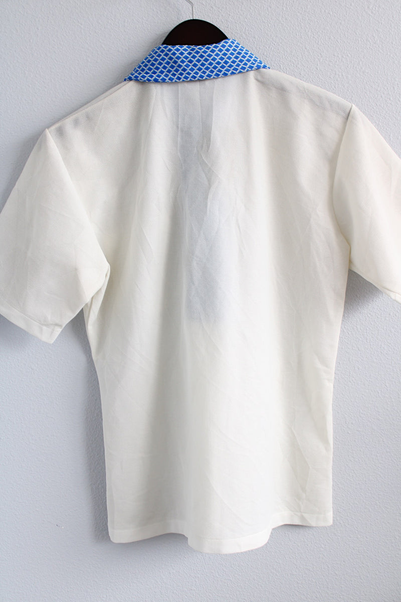 Women's or men's vintage 1970's Towncraft, JCPenney label short sleeve white polo top with blue dagger collar and a half button closure in a lightweight polyester material.