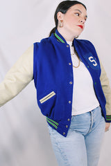 Men's or women's vintage 1970's Dehen, Award Letters, Beaverton, Oregon label long sleeve cream and vibrant blue varsity letterman jacket with green and yellow trim in wool and leather material.