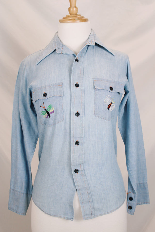 Men's or women's vintage 1970's JCPenney label long sleeve light blue chambray denim shirt with all over colored embroidery. 