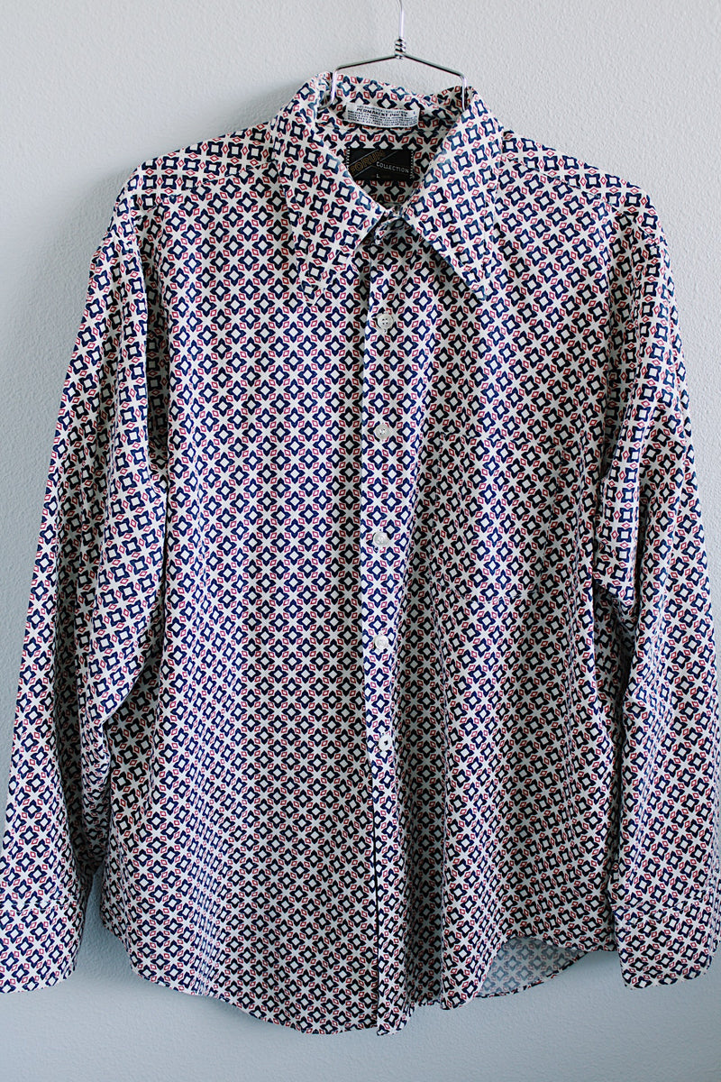 Women's or men's vintage 1970's Forum Collection label long sleeve button up shirt in white with all over navy and red abstract print. 