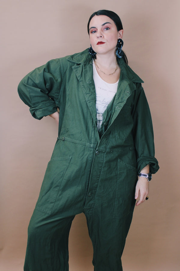 Men's vintage 1980's Men's Coveralls Type 1 label size XL long sleeve army green one piece jumpsuit with button closure and pockets in cotton material.
