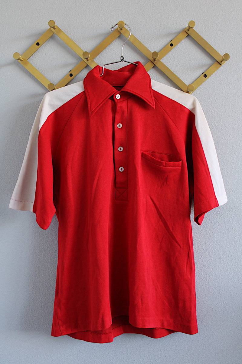 Men's or women's vintage 1970's short sleeve red polyester material half button closure polo shirt.