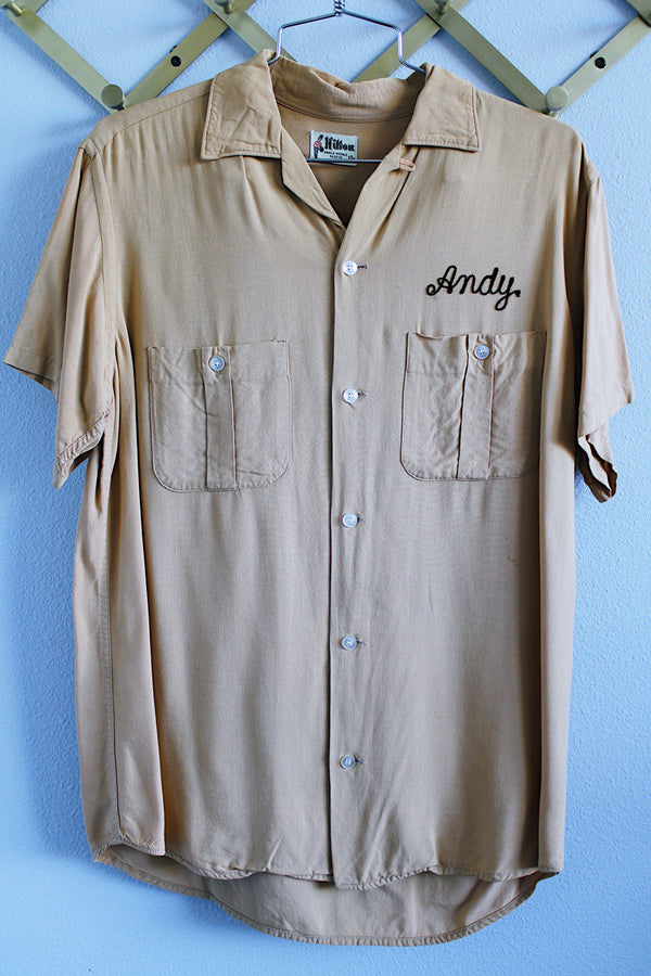 Men's or women's vintage 1960's Hilton, single needle sleeve label short sleeve button up bowling shirt in a beige tan cotton material.