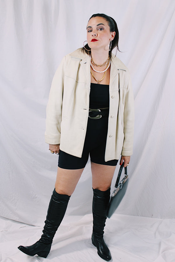 Women's vintage 1960's Custom Made Genuine Native Deerskin label long sleeve cream colored leather jacket. Fully lined, side pockets, and leather covered buttons.