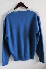 Women's or men's vintage 1980's Hogan label long sleeve blue argyle printed pullover sweater with a V shaped neckline in a soft acrylic material.
