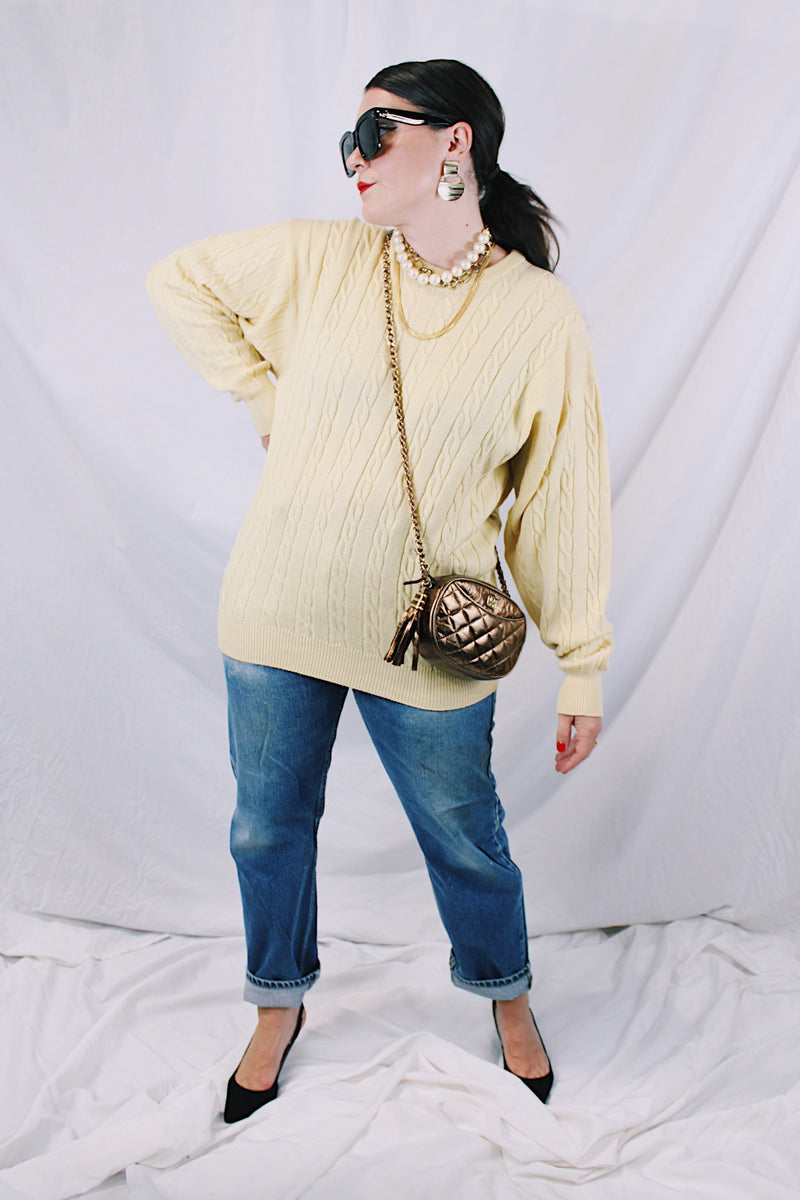 Men's or women's vintage 1960's Pringle label long sleeve pullover sweater in lambswool material. Butter yellow color and all over cable knit texture.
