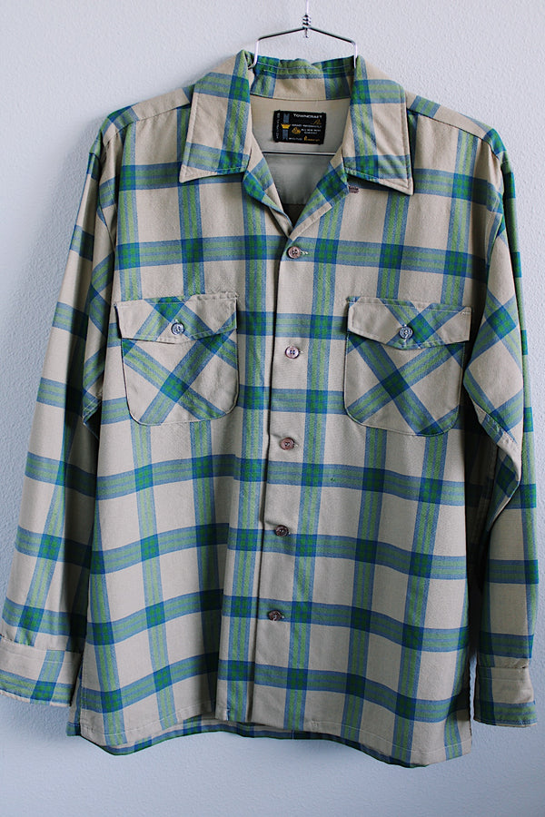 Men's vintage 1970's Towncraft, Penneys label long sleeve button up plaid shirt in tan color with blue and green plaid print. Chest pockets.