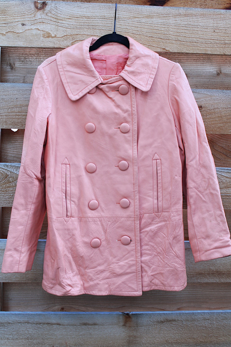 Women's vintage 1970's peach pink colored leather double breasted pea coat. Double lapel, pockets, and fully lined. 